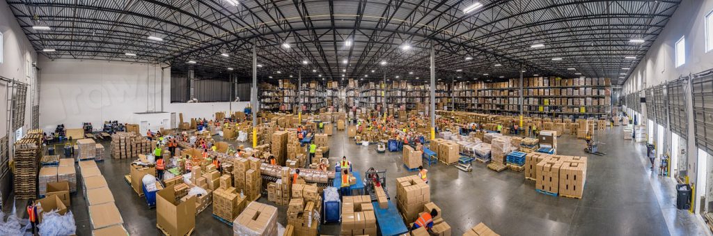 Large distribution centre floor with boxes and workers
