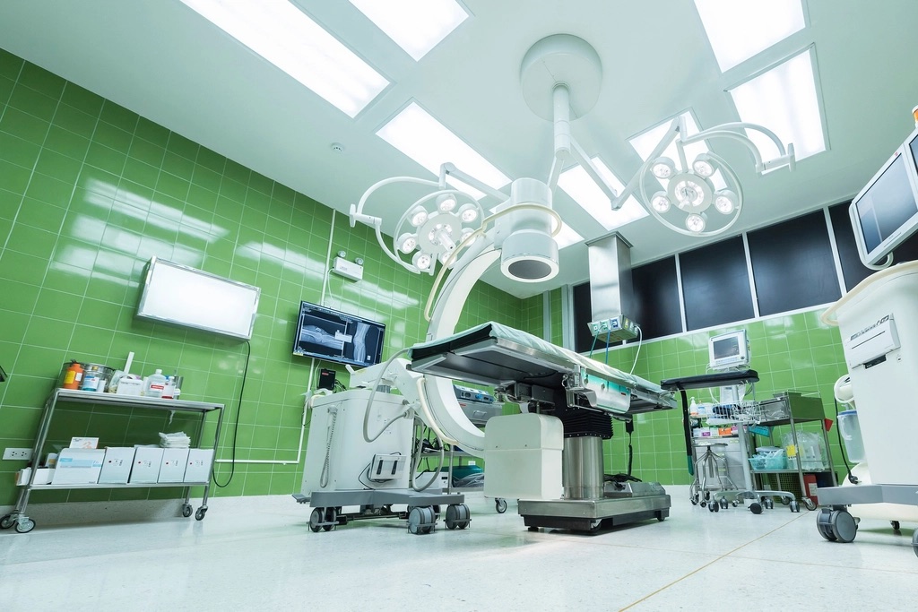 Operating room with surgical imaging equipment and monitors
